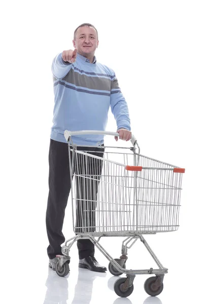 In full growth. confident casual man with shopping cart — Stock Photo, Image