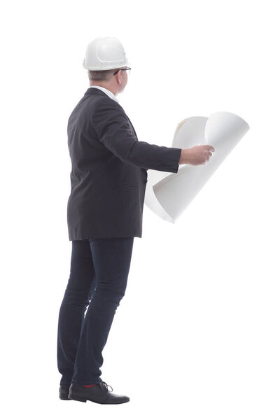 side view. experienced architect carefully reading the new drawi