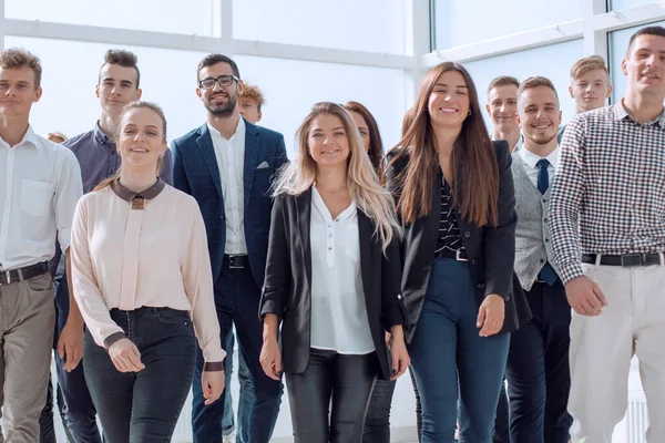 Young business people walking together in a new office — Stock Photo, Image