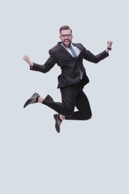 Tam gelişim. Mutlu dans eden genç iş adamı
