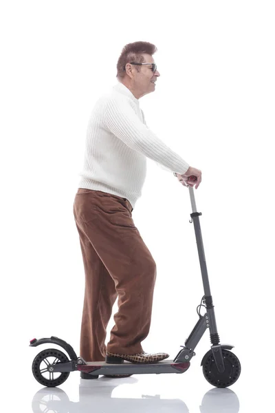 In full growth. casual adult male with electric scooter. — Stock Photo, Image