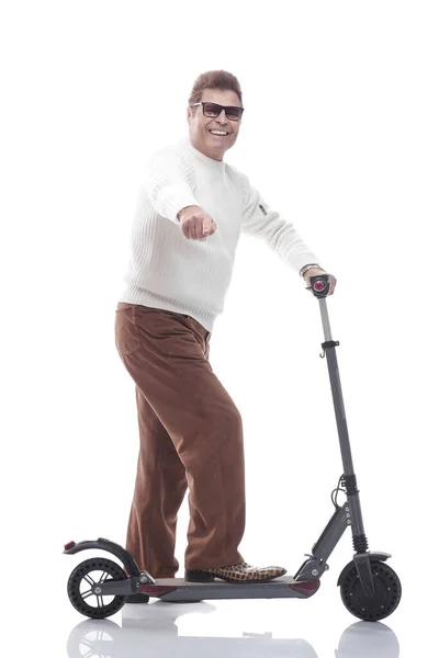 Full- length . modern adult male with electric scooter pointing at you. — Stock Photo, Image