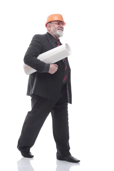 Mature architect with a roll of drawings stepping forward — Stock Photo, Image