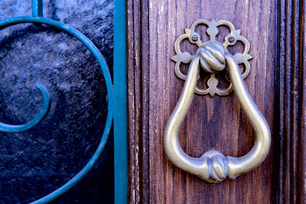 Closeup  antique door with gold bronze door handle