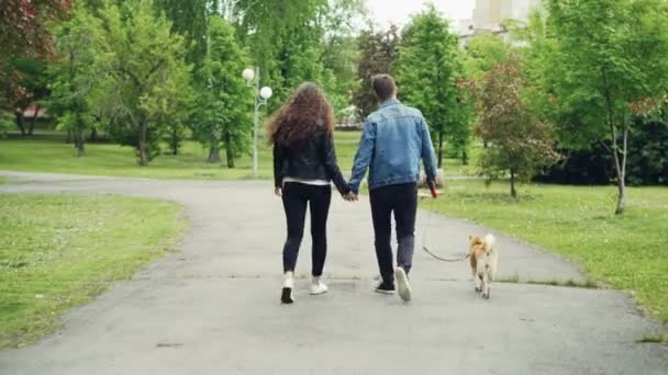Jocelyn is walking with her boyfriend in the park