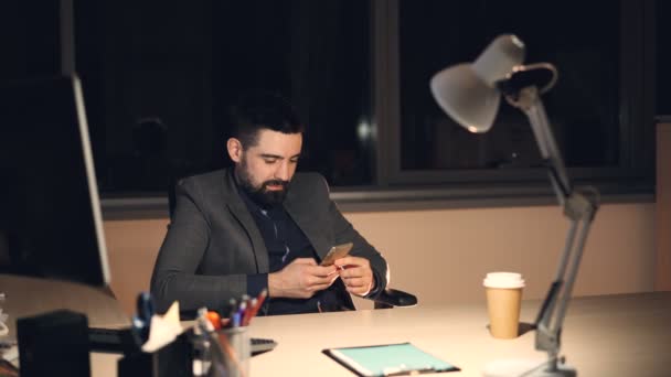 Handsome Bearded Young Man Using Smartphone Touching Screen Smiling Working — Stock Video