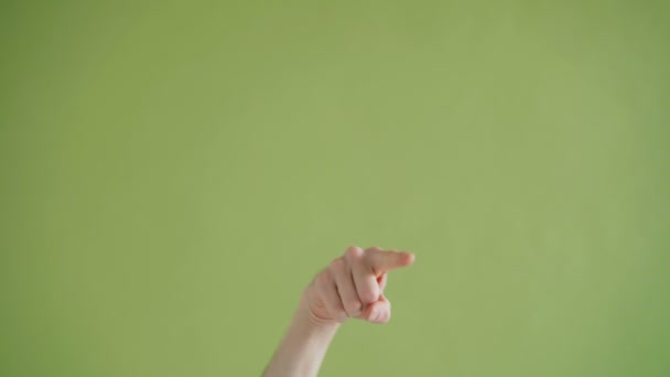 Close-up shot of hand pointing at camera making come here gesture with thumbs-up — Stock Video