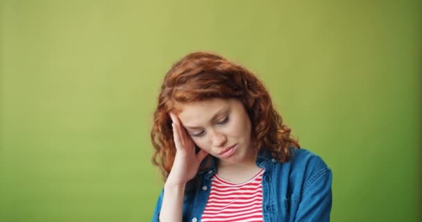 Portrait of unhappy girl standing alone touching sad face looking at camera — Stock Video