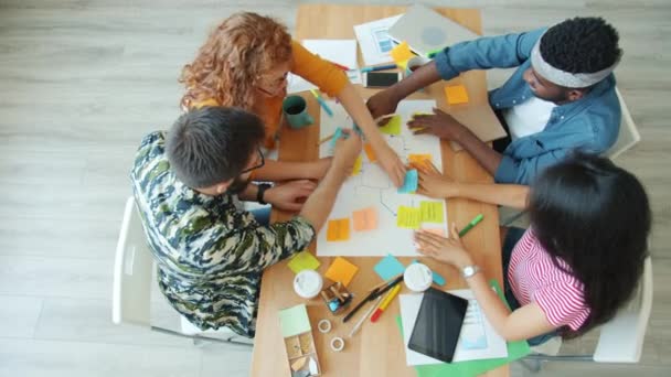 Group of people office workers sharing ideas making collage then joining hands — Stock Video