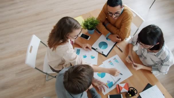 High angle view of cheerful youth talking working in office then doing high-five — Stock Video