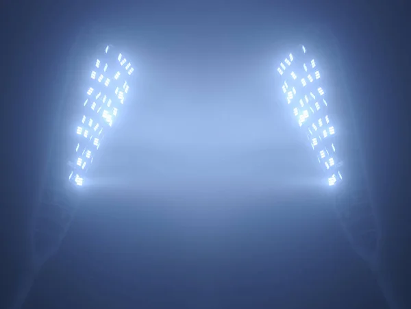 Stadion-Flutlichter gegen dunklen Nachthimmel — Stockfoto