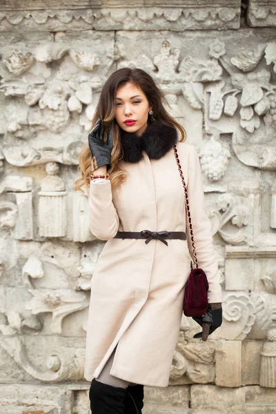 Young beautiful woman in beige coat — Stock Photo, Image