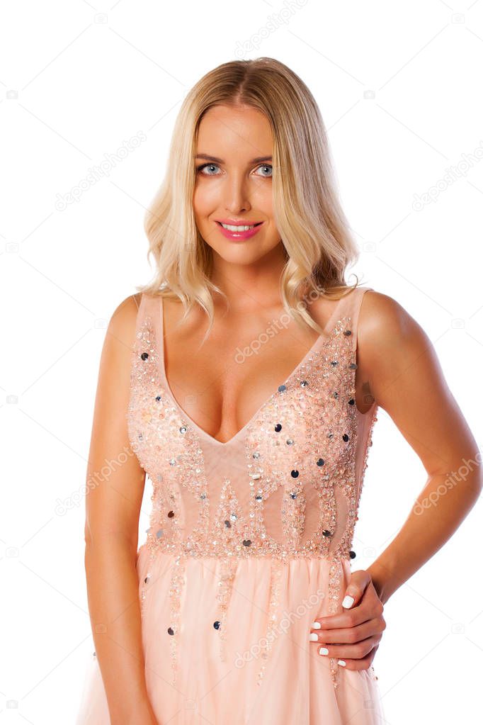 Fashion portrait of pretty sexy young blonde woman in pink dress posing on white isolated background 