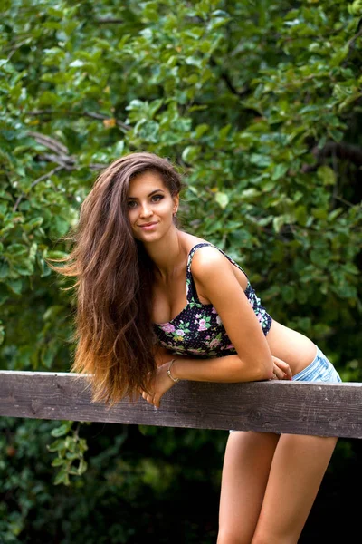 Portrait of a beautiful woman in sexy shorts — Stock Photo, Image