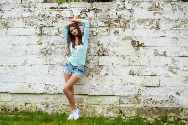 Young Beautiful Brunette Woman Short Blue Jeans Shorts Posing Stone — Stock Photo, Image
