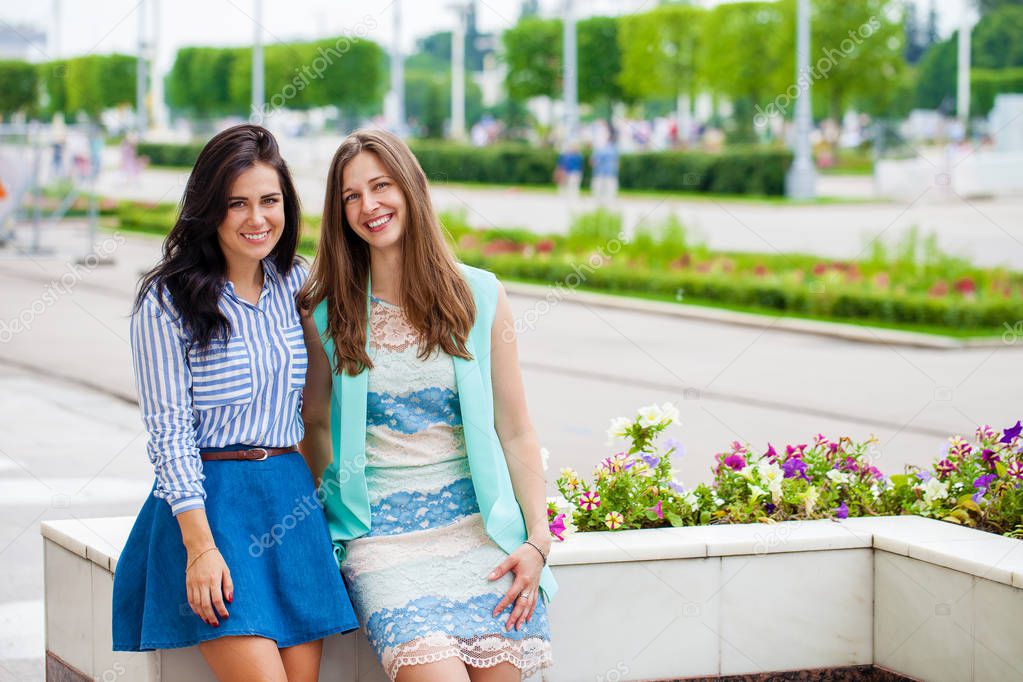 Close up, Two happy young women in summer street, outdoors