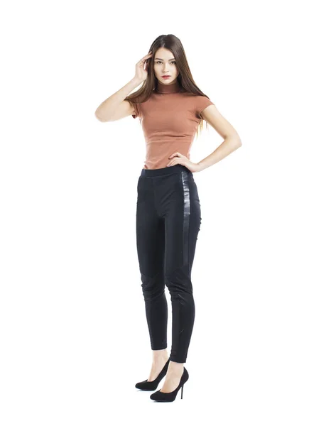 Hela kroppen, ung vacker brunett kvinna i svarta byxor — Stockfoto