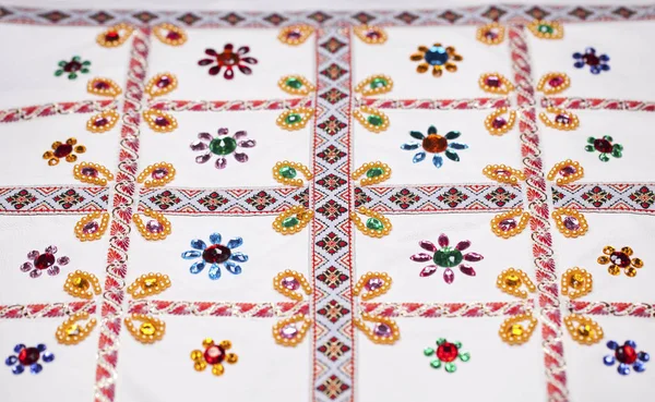 Embroidery on white fabric — Stock Photo, Image