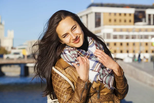 Young happy woman in brown leather jacket — Stock Photo, Image