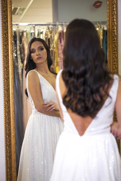 Young brunette model in sexy dress — Stock Photo, Image