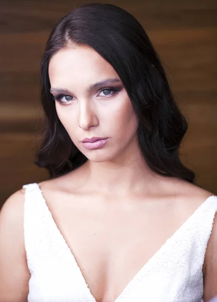 Portrait close up of young beautiful brunette woman in white dre — Stock Photo, Image