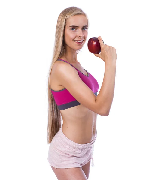 年轻美丽性感的女人在运动服与红色苹果 — 图库照片