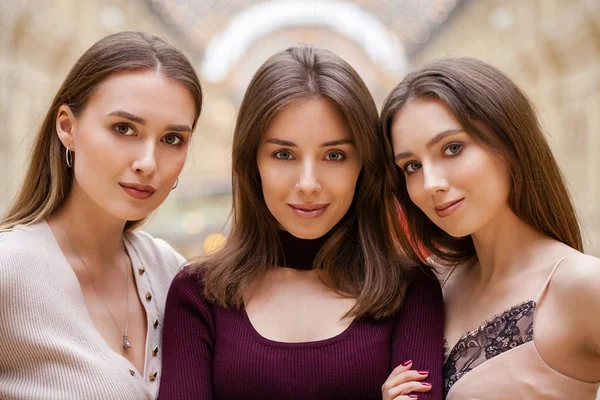 Three brunette young women, indoor — Stock Photo, Image