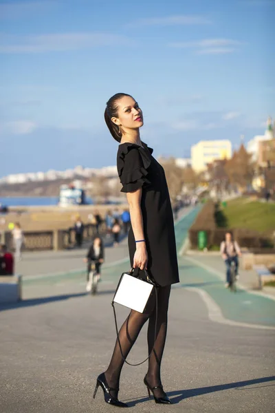 Portrait of a young beautiful woman in black dress — Stock Photo, Image