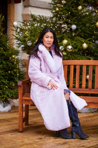 Happy asian woman in winter coat from faux fur — Stock Photo, Image