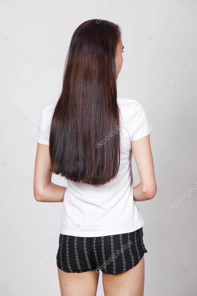 Female brunette hair, rear view, isolated on white background