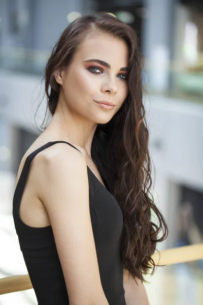 Make up beauty. Close up portrait young brunette woman in black — Stock Photo, Image