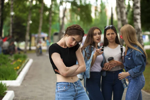 Four schoolgirls in summer park — Stock Photo, Image