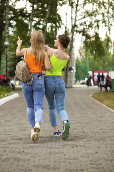 Two girlfriends walking on summer park, outdoors — Stock Photo, Image