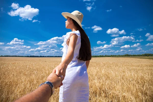 Come with me, young beautiful girl holds the hand of a man in a — Stock Photo, Image