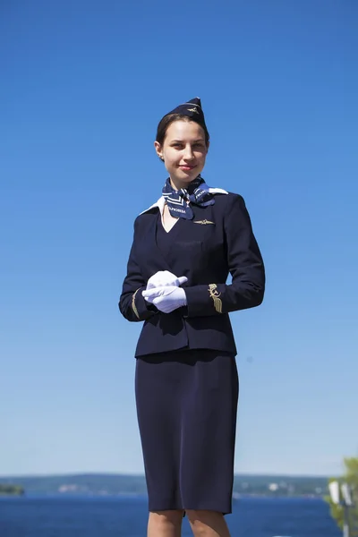 Beautiful stewardess dressed in official blue uniform — Stock Photo, Image