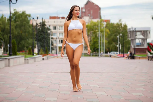 Full body portrait beautiful sexy brunette woman in white bikini — Stock Photo, Image