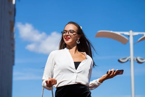 Business brunette woman in summer street