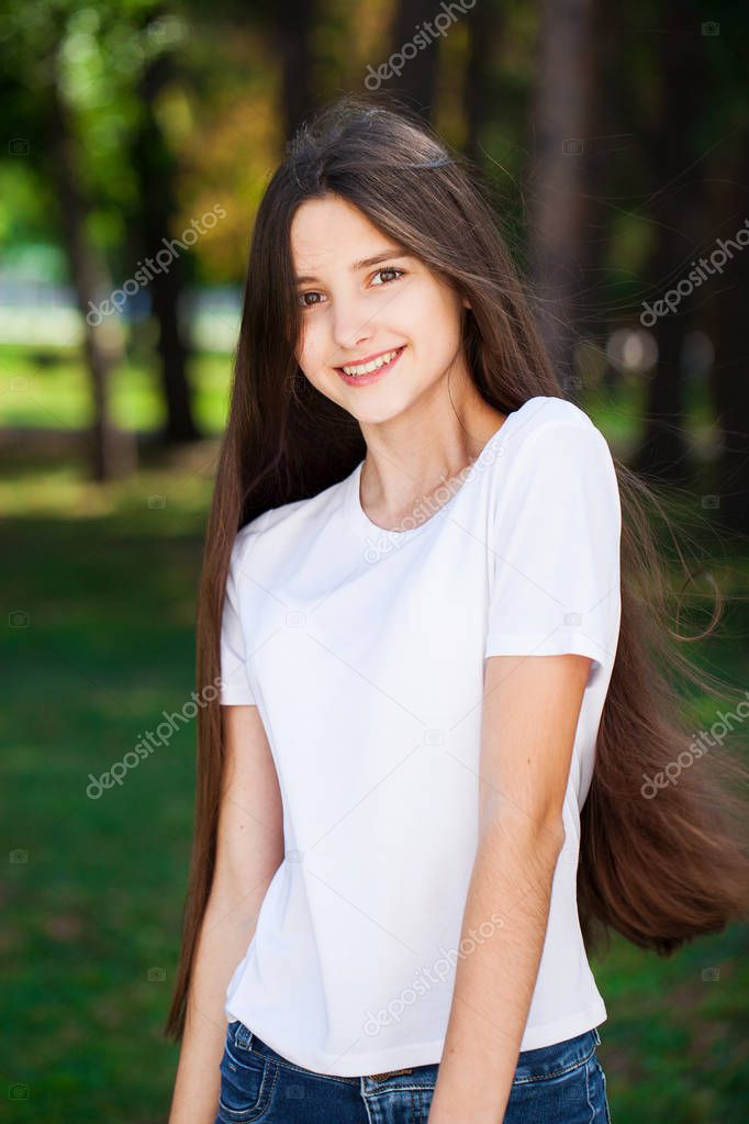 Young beautiful blonde girl with bare shoulders 