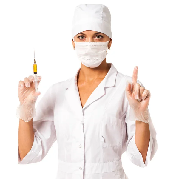 Young nurse in a white coat holds a syringe in his hands Stock Picture