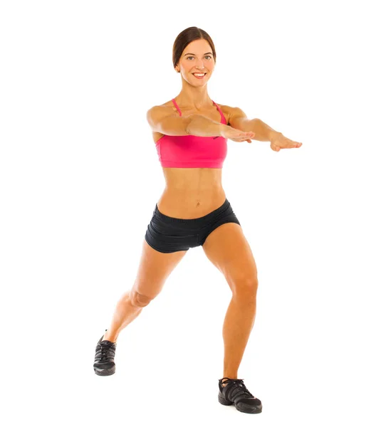 Junge Fitness-Brünette in rotem Top und schwarzen Shorts — Stockfoto