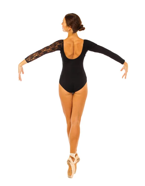 Portret młodej pięknej baleriny w czarnym stroju baletowym, jest — Zdjęcie stockowe