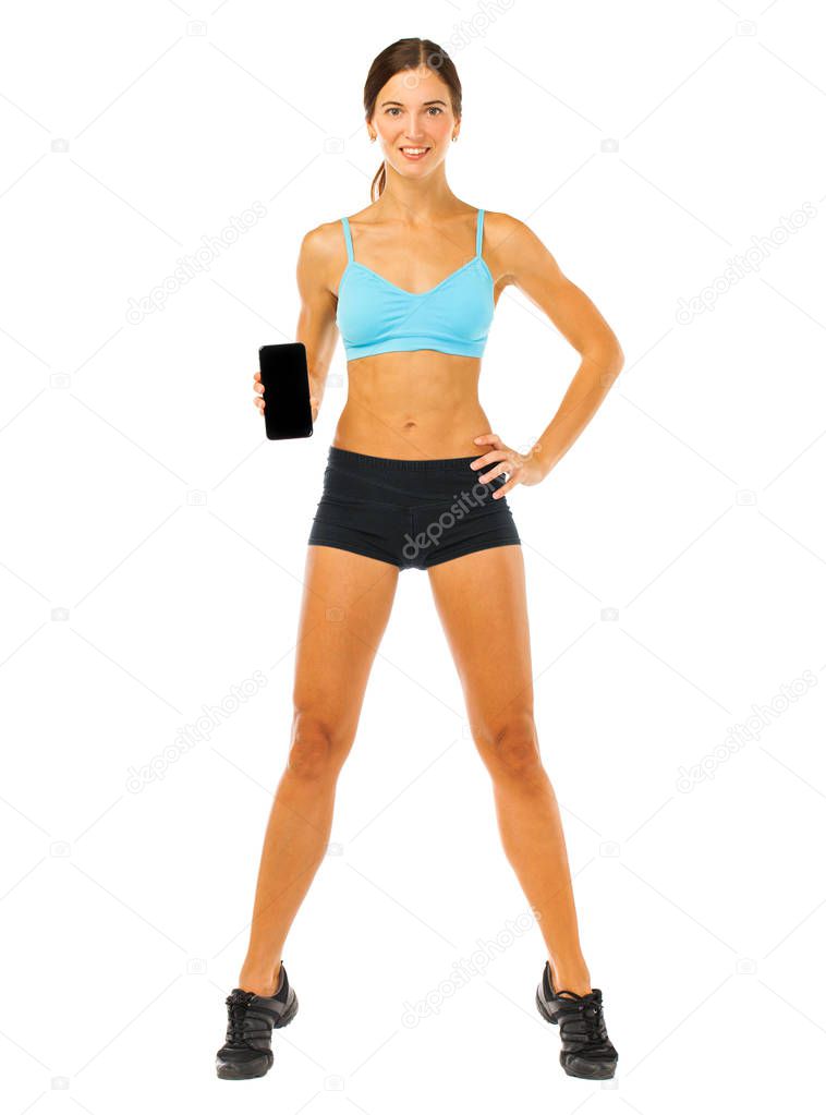 Cheerful young fitness woman showing blank smartphone screen iso