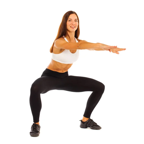 Sexy fitness vrouw poseren in studio - geïsoleerd op een witte rug gr — Stockfoto