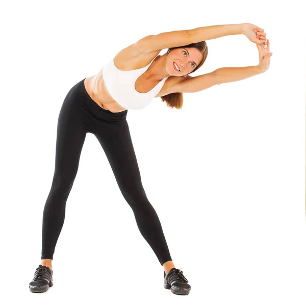 Sexy fitness woman posing in studio - isolated on a white backgr — Stock Photo, Image