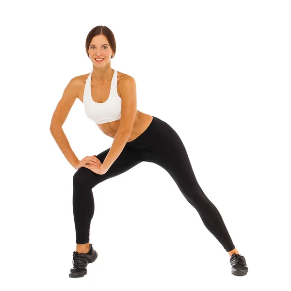 Sexy fitness woman posing in studio - isolated on a white backgr — Stock Photo, Image