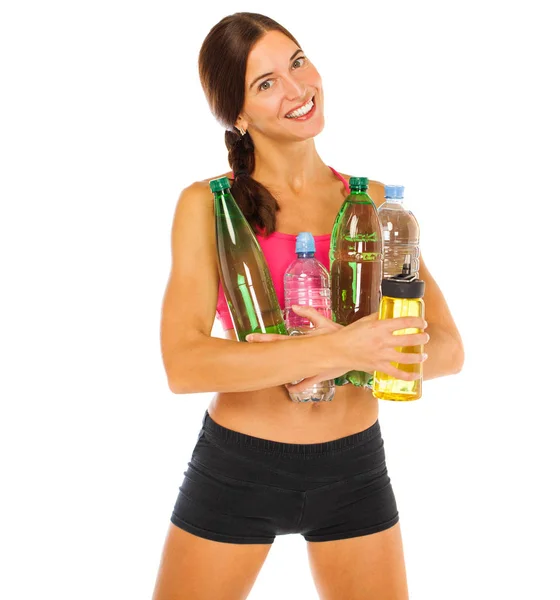 Young athletic model holding a lot of water bottles — Stock Photo, Image