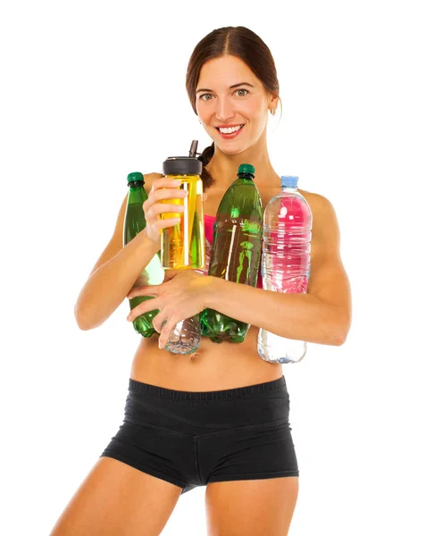 Young athletic model holding a lot of water bottles — Stock Photo, Image