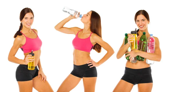 Young athletic girl drinks water from a bottle - isolated on whi — Stock Photo, Image