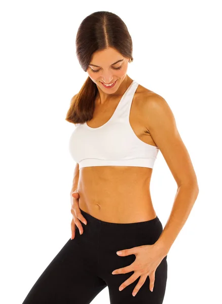 Fitness-Modell mit flachem Bauch auf weißem Hintergrund — Stockfoto