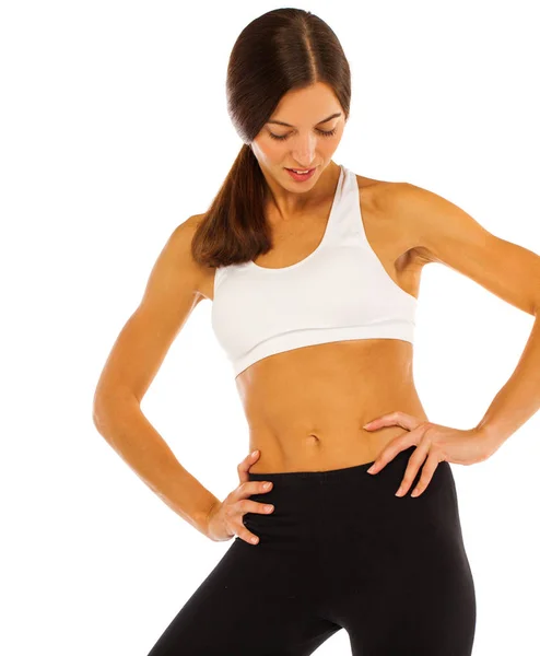 Modello fitness con uno stomaco piatto isolato su uno sfondo bianco — Foto Stock